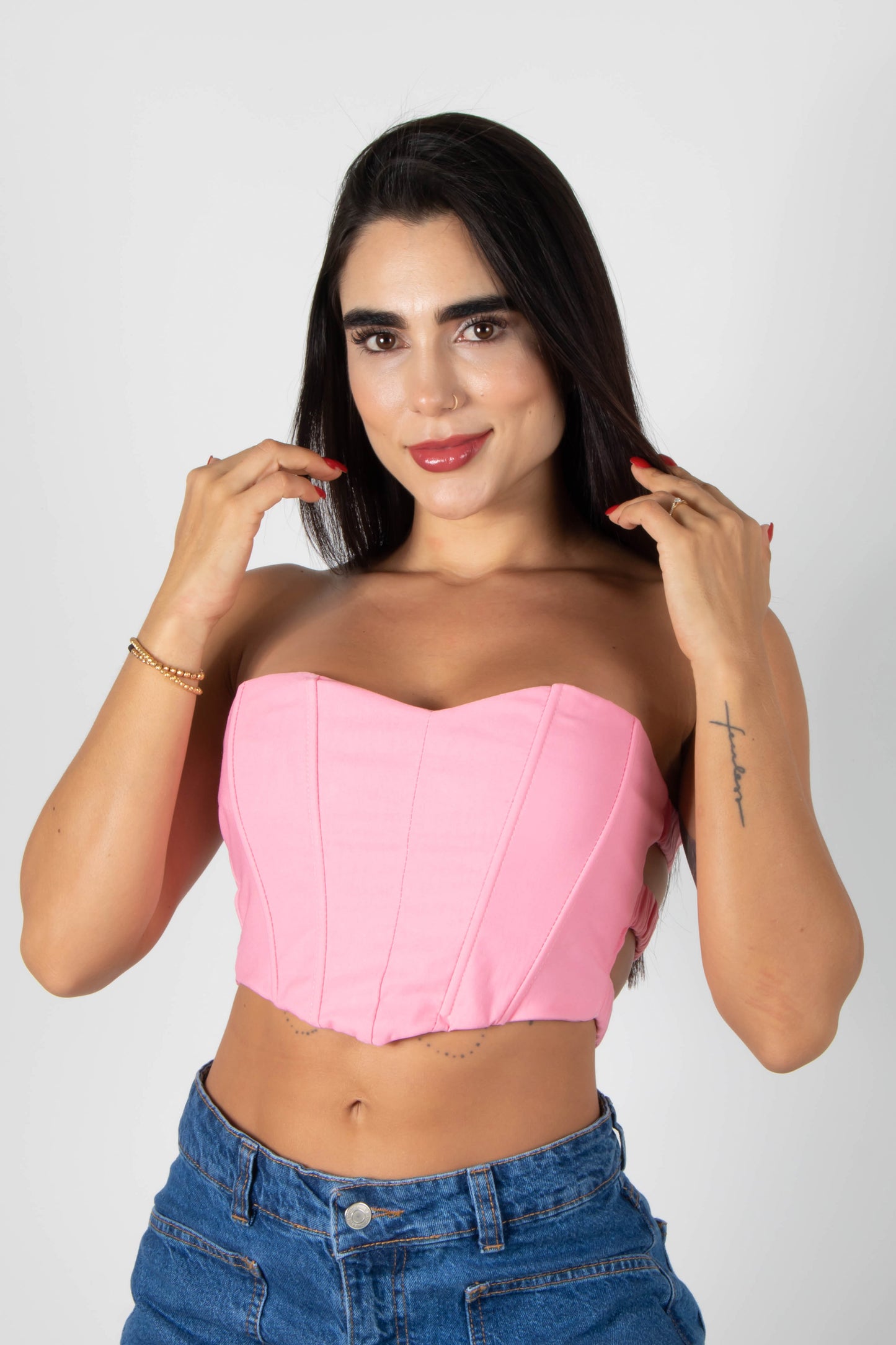 CROP TOP TIPO CORSET STRAPLESS CON ELONGACIÓN POSTERIOR