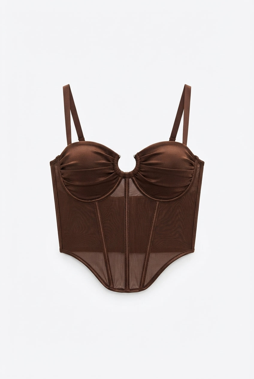 Corset Nilmar translúcido para mujer con copas fruncidas, aro central metálico, varillas moldeadoras y tirantes ajustables.