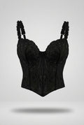 Corset Violeta para mujer en encaje bordado negro con copas estructuradas, cargaderas fruncidas y ruedo inferior en pico.