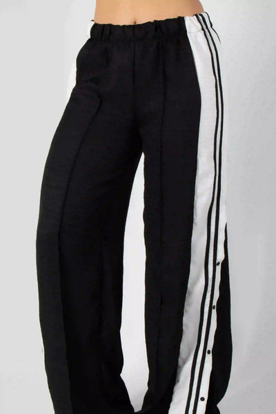 PANTALON CON ELONGACION EN CINTURA Y LINEAS DECORATIVAS
